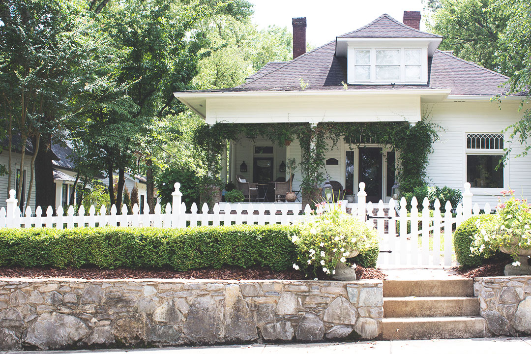 Lotus Building Group had the opportunity to custom make this white picket fence for this lovely home, as well as design and build the custom wine rack and screened in porch! Contact us for your historic home restoration contractor in Nashville, TN.