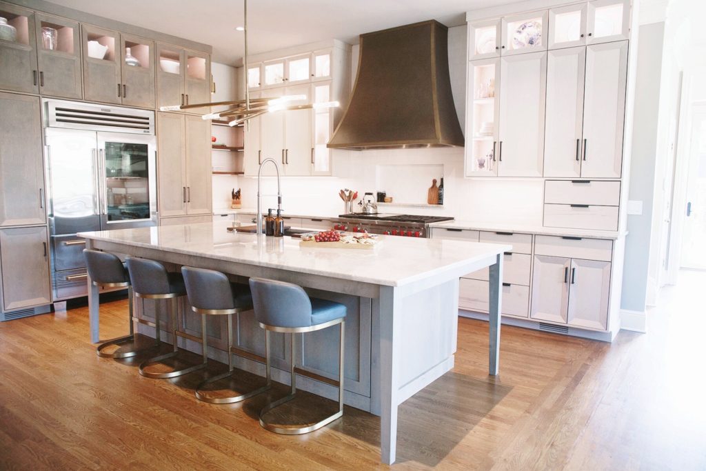 Residential kitchen renovation project. This kitchen features white cupboards and stainless steel accent fixtures. Contact Lotus Building Group as your kitchen remodel contractor in Nashville, TN.