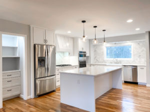 Residential kitchen renovation project. This kitchen features white cupboards and stainless steel accent fixtures. Contact Lotus Building Group as your kitchen remodel contractor in Nashville, TN.