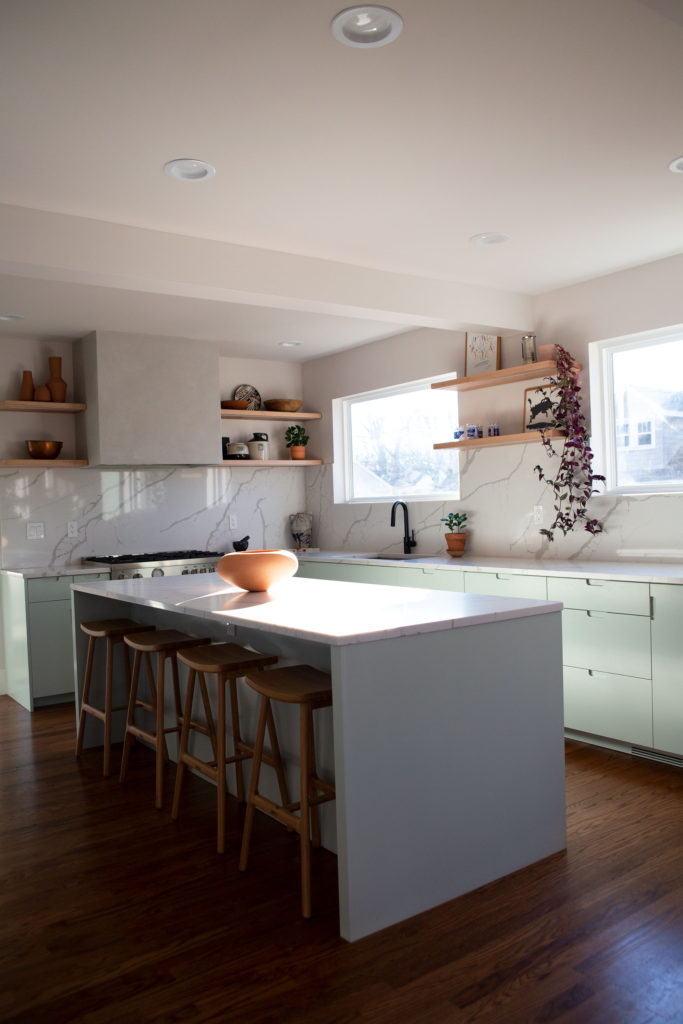 Residential kitchen renovation project. This kitchen features an island, white cupboards and stainless steel accent fixtures. Contact Lotus Building Group as your kitchen remodel contractor in Nashville, TN.