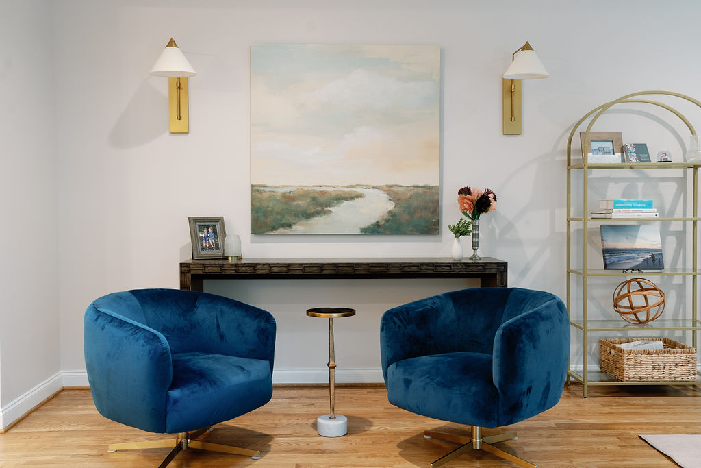 Residential renovation project featuring a home bar. This room features wood flooring, white walls and teal accent furniture. Contact Lotus Building Group as your home renovation contractor in Nashville, TN.