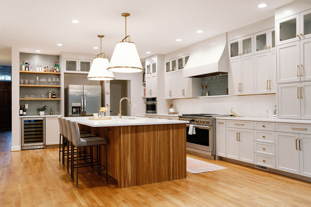 Residential kitchen renovation project. This kitchen features white cupboards and stainless steel accent appliances with gold fixtures. Contact Lotus Building Group as your kitchen remodel contractor in Nashville, TN.